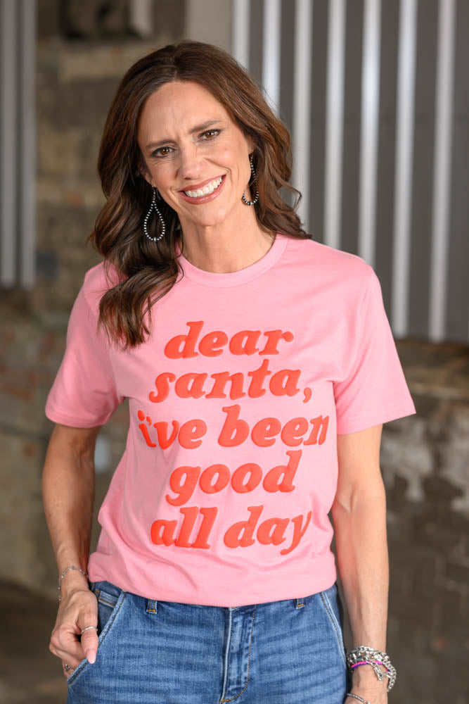 Jennifer Smith of STS Ranch/930 Remnant modeling a pink tshirt with red writing that says, "Dear Santa, I've been good all day."