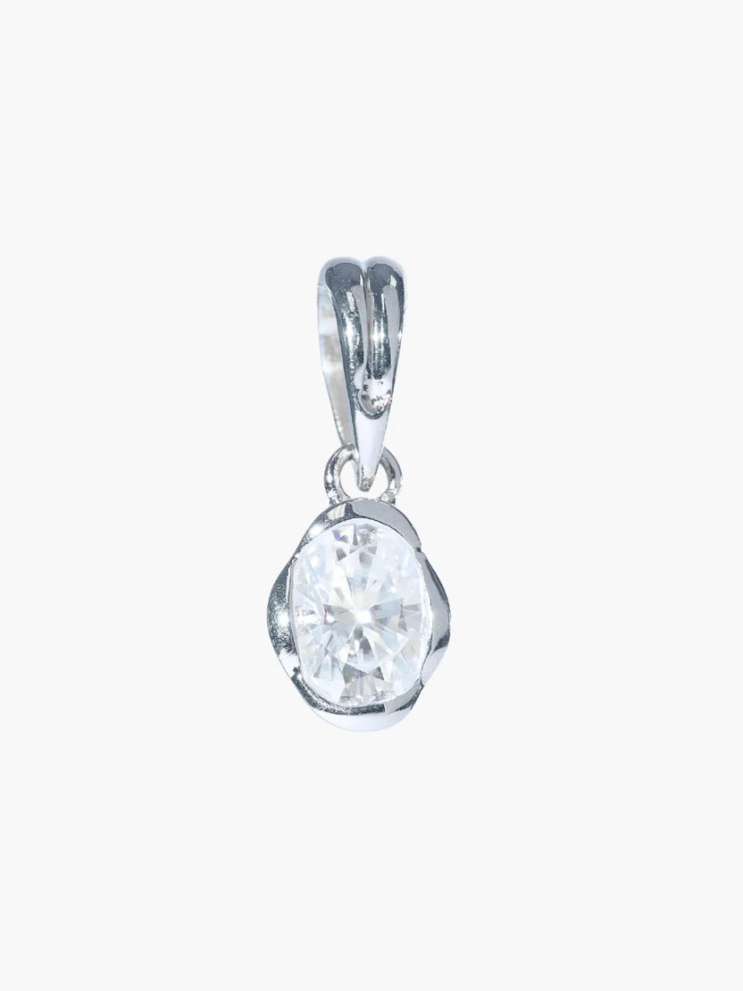 Silver pendant with a clear gemstone on a white background