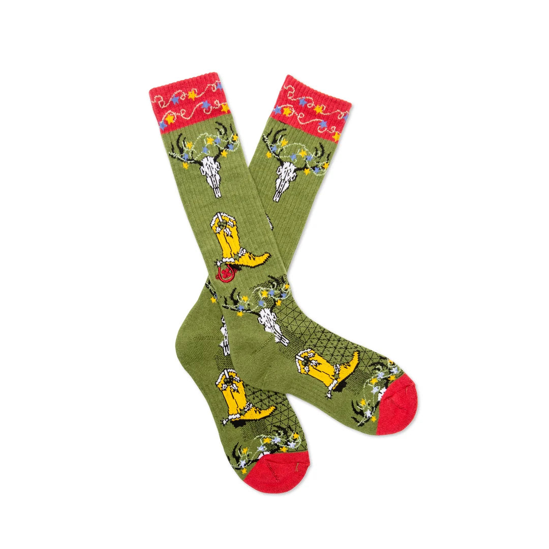 Green socks with yellow dog prints and red accents on a white background