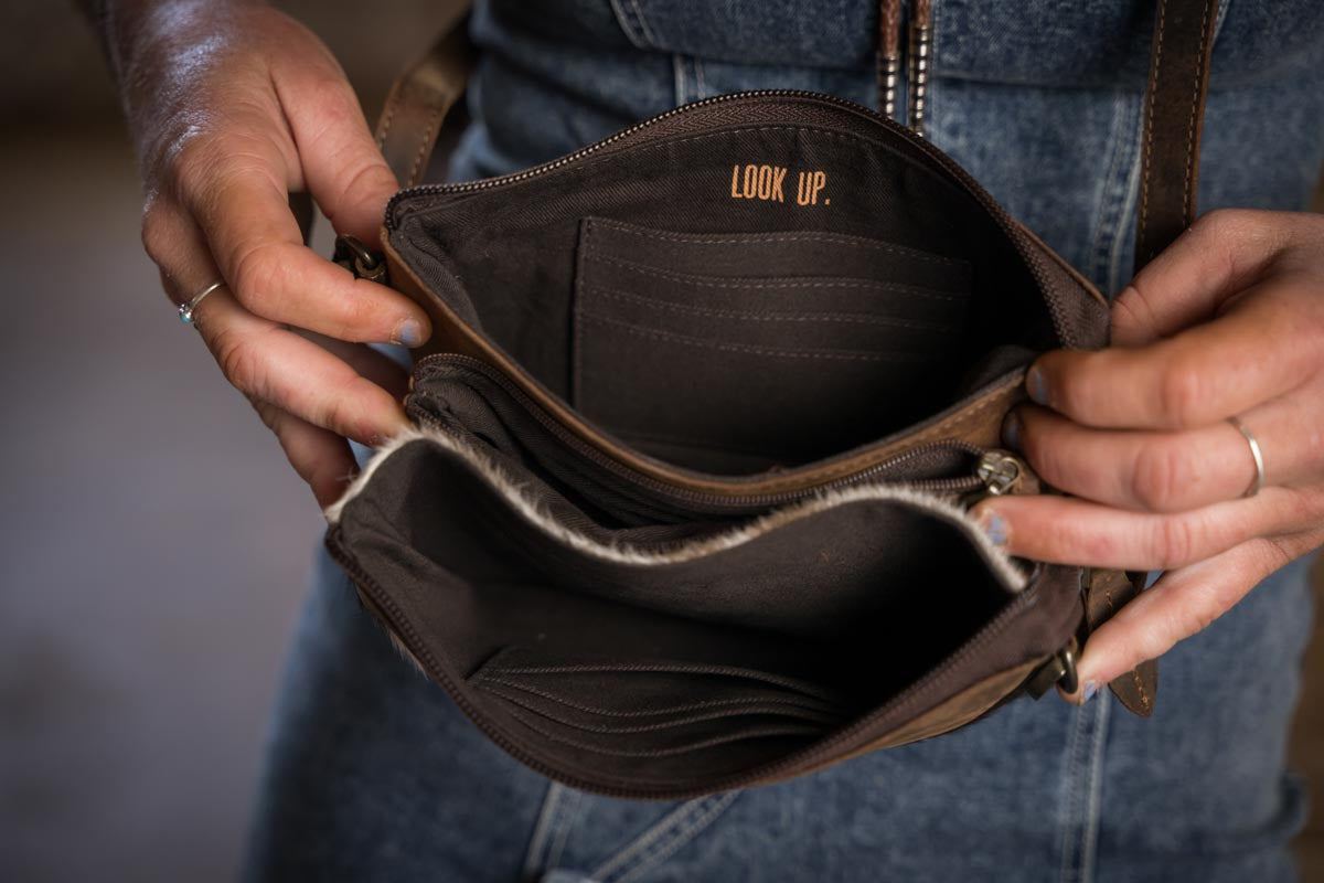 Inside view of the Cowhide Rio Crossbody Bag with 8 card slots and zip storage Jennifer Smith STS Ranch