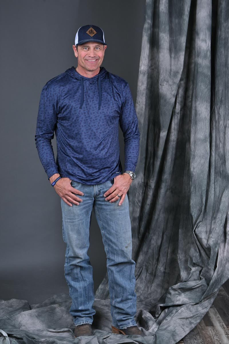 Stran Smith STS Ranch wearing Stars & Stripes Performance Hoodie and STS Ranchwear cap