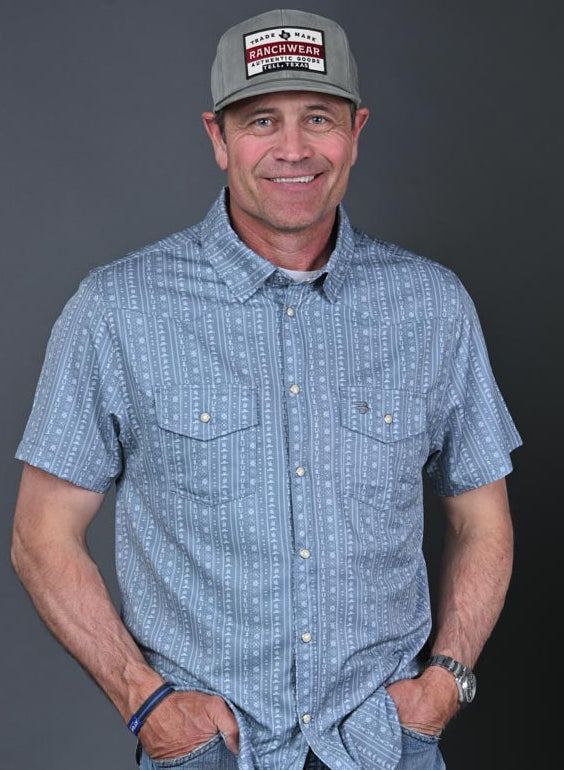 Stran Smith STS Ranch wearing Burlebo Sage performance western shirt and an STS Ranchwear hat