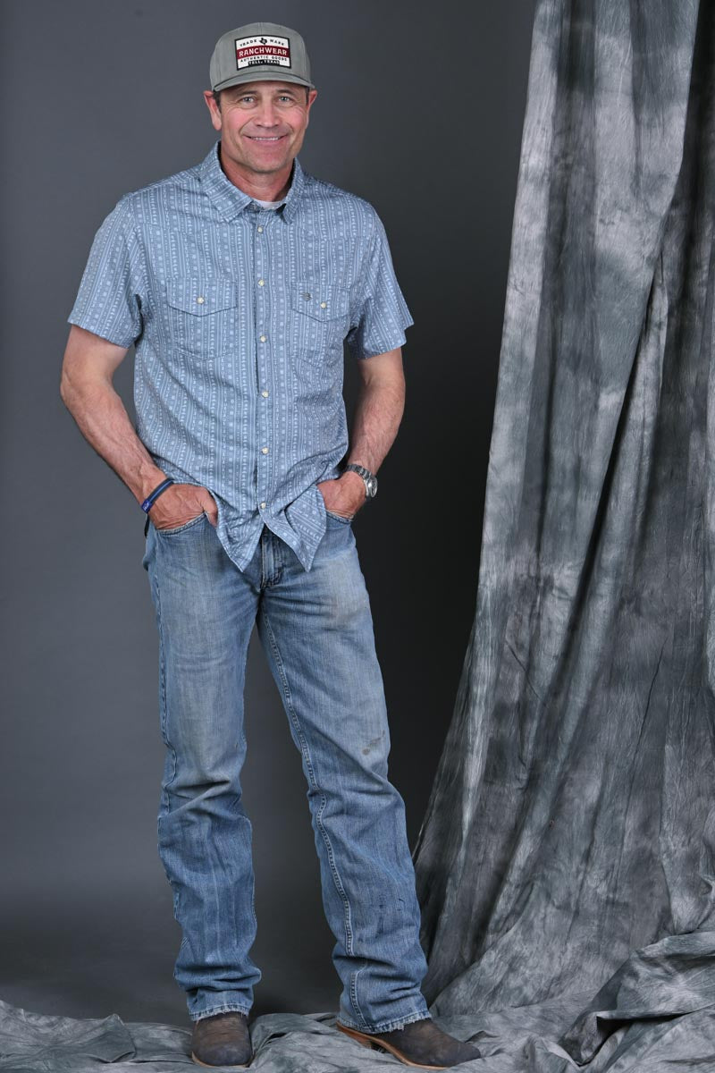 Stran Smith STS Ranch wearing Burlebo Sage performance western shirt and an STS Ranchwear hat
