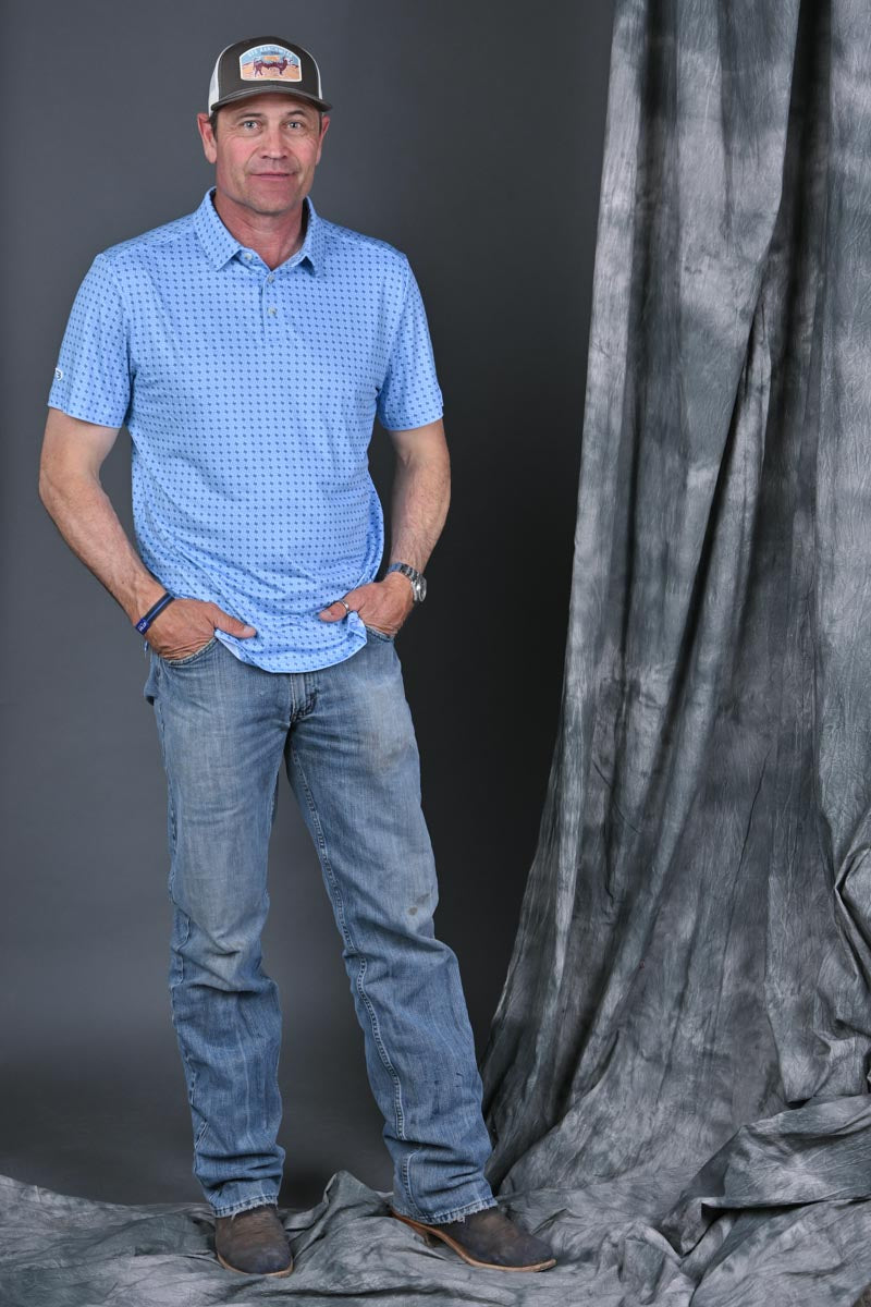 Stran Smith STS Ranch wearing Texas Light Blue Performance Polo and STS Ranchwear cap