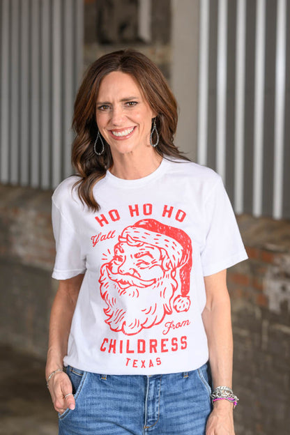 Jennifer Smith of STS Ranch and 1930 Remnant modeling a Christmas graphic tee shirt that reads, "Ho Ho Ho Y'all from Childress, Texas."