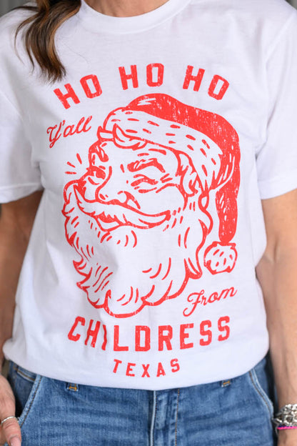 Jennifer Smith of STS Ranch and 1930 Remnant modeling a Christmas graphic tee shirt that reads, "Ho Ho Ho Y'all from Childress, Texas." close up shot