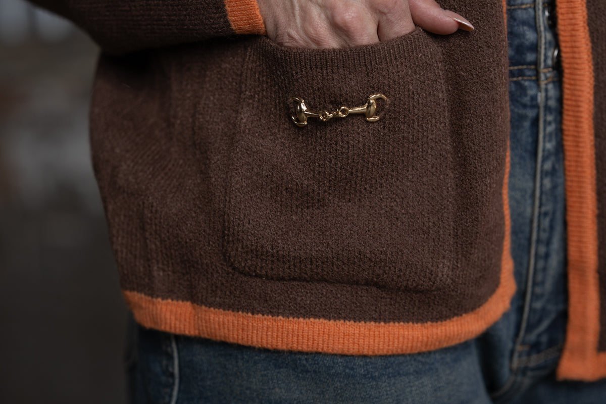 pocket with gold snaffle bit