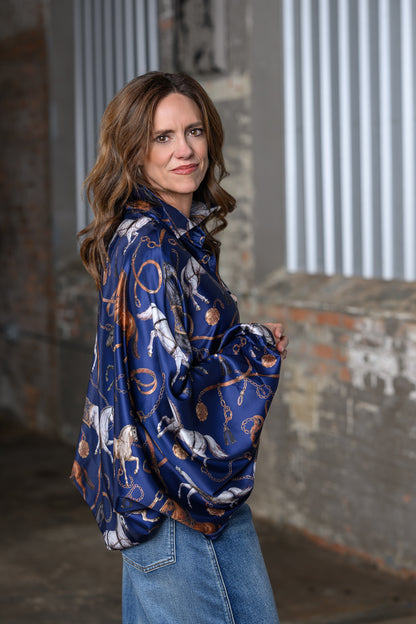 Side view of Jennifer Smith of STS Ranch/1930 Remnant wearing the Beulah Style Equestrian top in navy. 