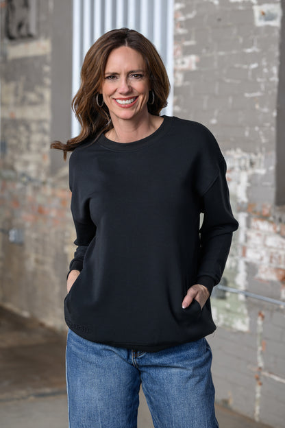 Jennifer Smith of STS Ranch & 1930 Remnant modeling the Rizen black "Chosen" Sweatshirt, front view