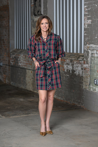 full length view of Jennifer Smith of STS Ranch/1930 Remnant wearing a tartan black shirt dress by Ivy Jane in a warehouse