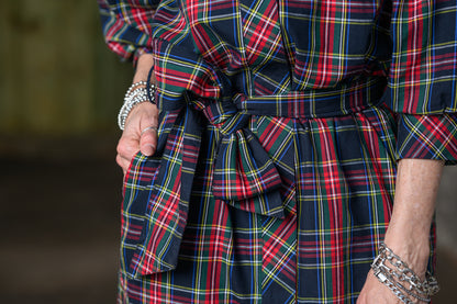 close up of Jennifer Smith of STS Ranch/1930 Remnant wearing a tartan black shirt dress by Ivy Jane in a warehouse