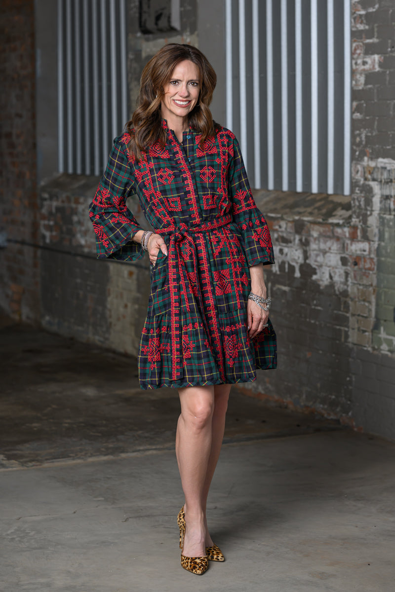 Full length photo of Jennifer Smith of STS Ranch 1930 Remnant modeling an embroidered shirtdress by Ivy Jane