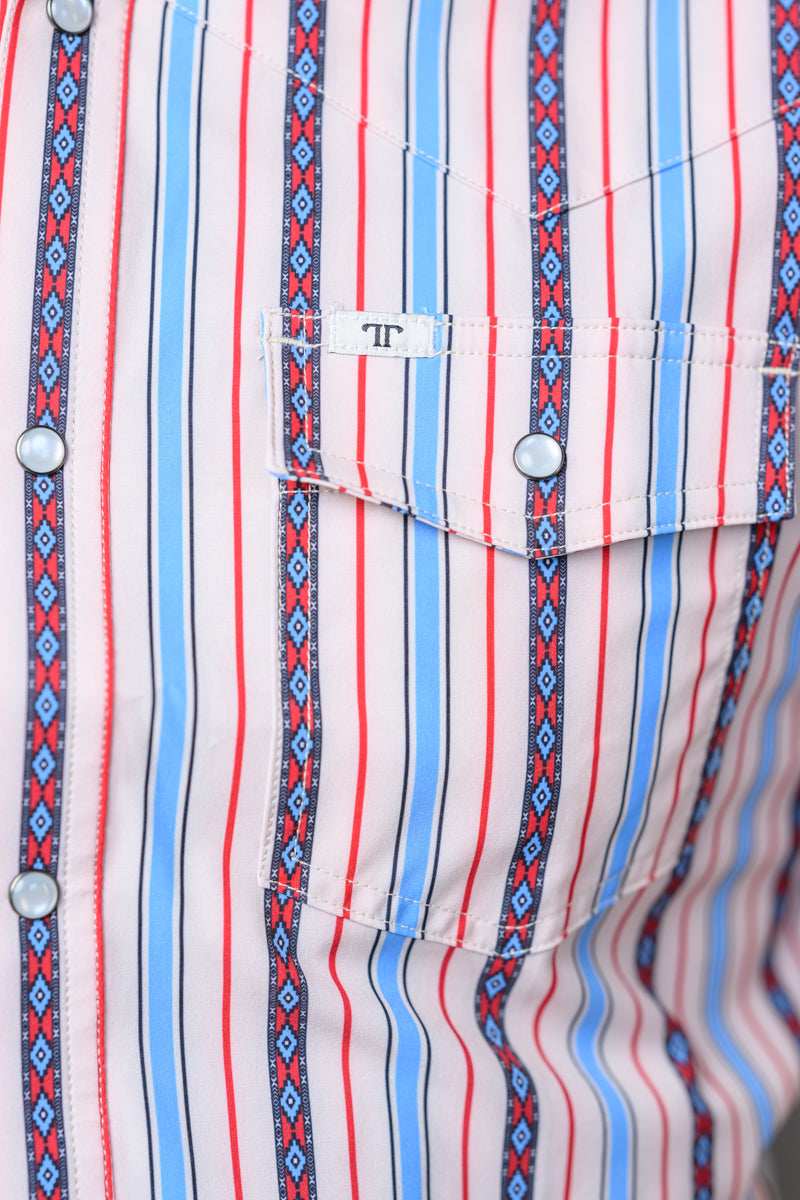 Close-up of a striped pearl snap shirt with vertical red, blue, and white stripes, patterned side panels, and a chest pocket with a small white label reading 'FF'.
