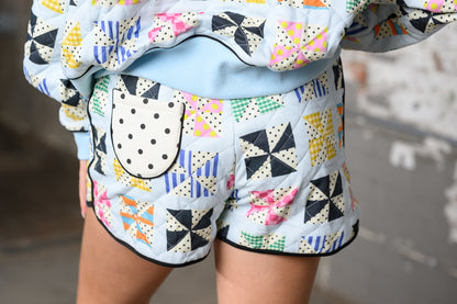 close up of back of Poppy & Pine Quilted Kaleidoscope shorts on a model with matching shorts