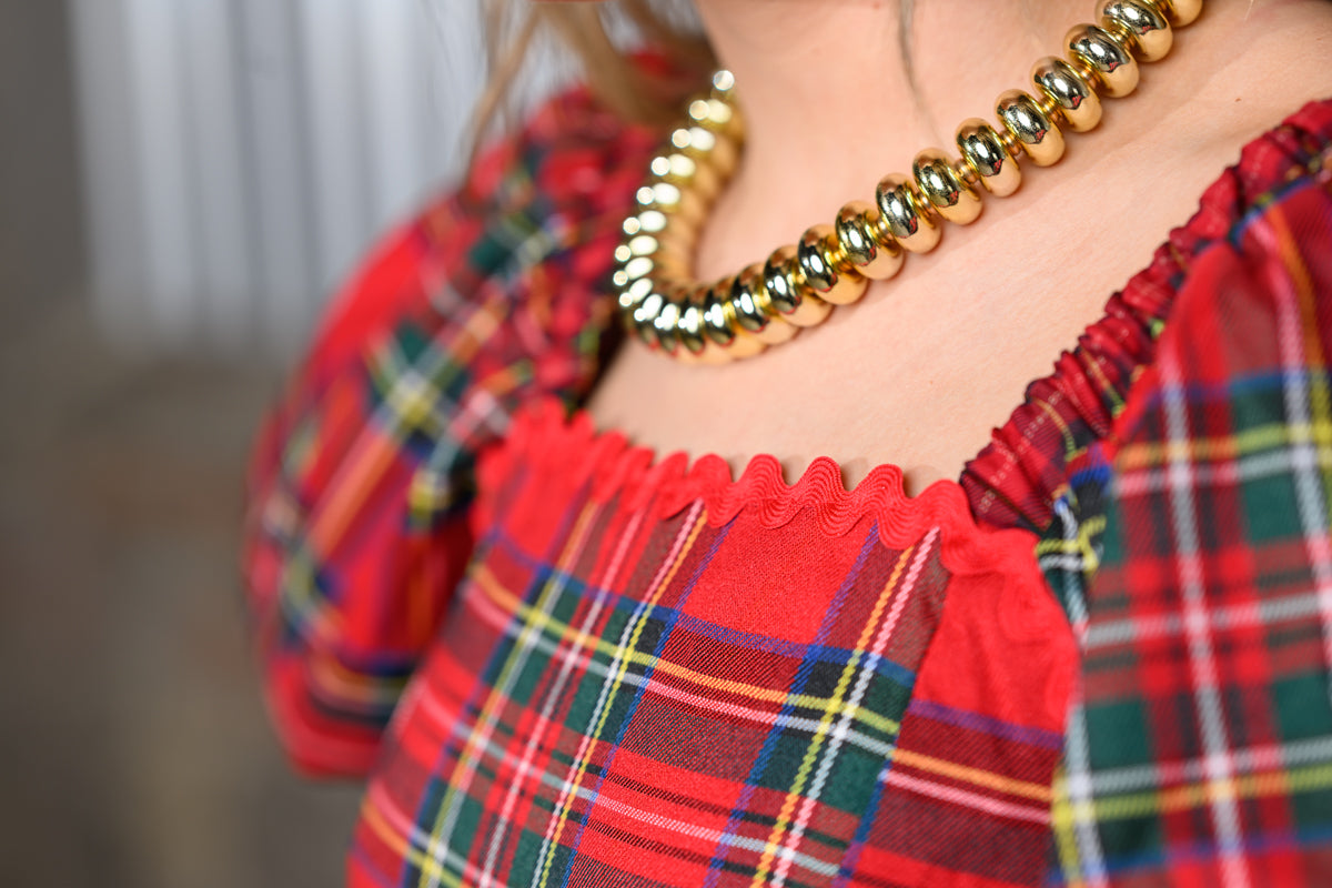 model wearing the JODIFL Red Plaid Ric-Rac Dress – Women's Plaid Statement Dress close up front view 