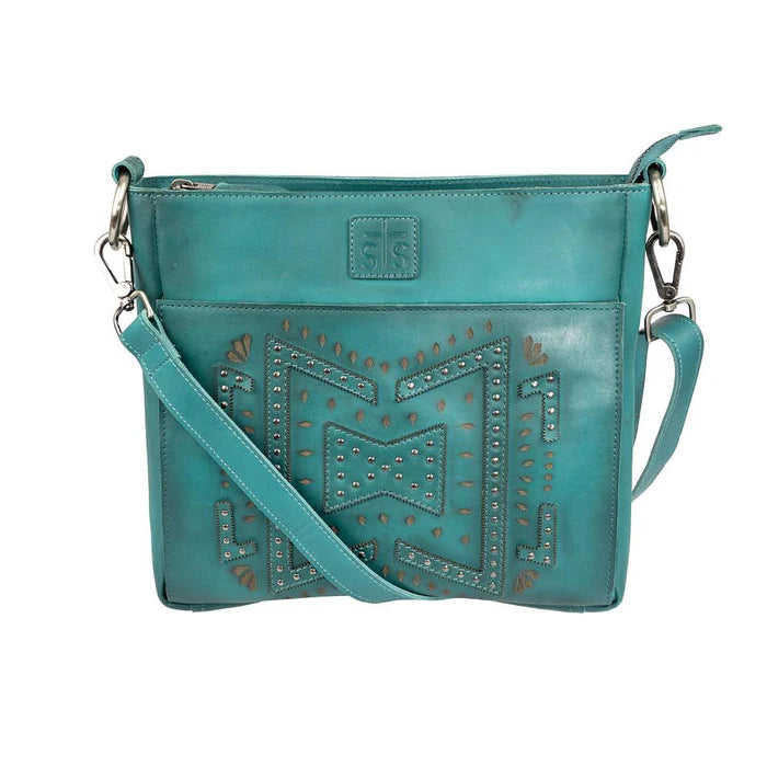 Turquoise leather crossbody purse with studded western design front view cutout
