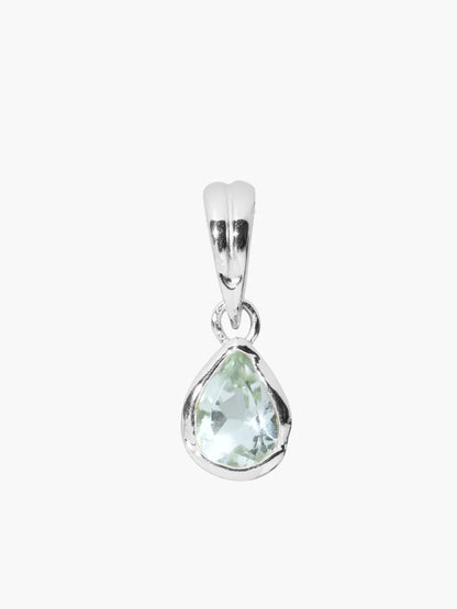 Silver pendant with a green gemstone on a white background