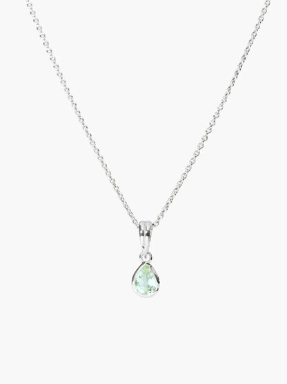A silver chain necklace with a teardrop-shaped pendant featuring a light green gemstone, set against a plain light gray background.