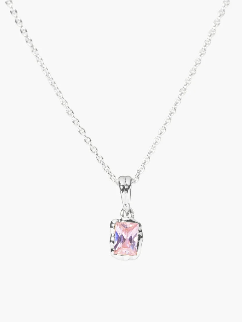 Pink gemstone necklace on a white background