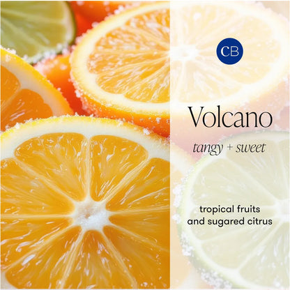 A fragrance label or packaging graphic for CB Volcano, featuring close-up fruit photography of citrus slices including orange, lime, and mandarin with sugar crystals. Text on the right reads 'CB Volcano', 'tangy + sweet', and 'tropical fruits and sugared citrus'.