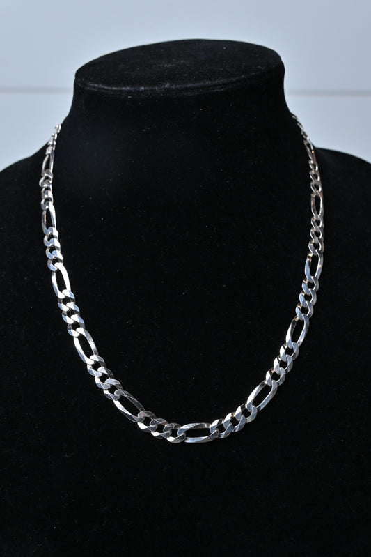 mens sterling silver figaro chain necklace on display