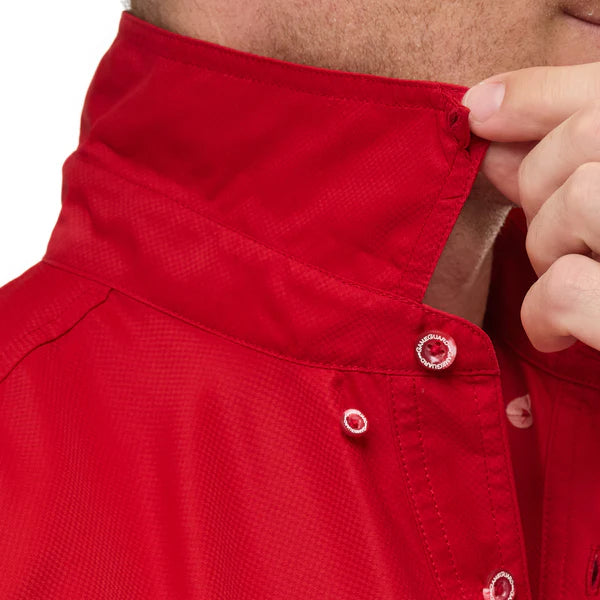 Close-up of a red shirt with buttons being adjusted by a hand.