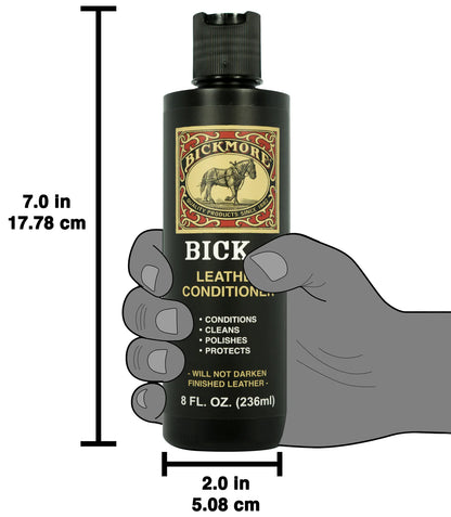 Bickmore leather conditioner bottle with dimensions and a hand holding it for scale.