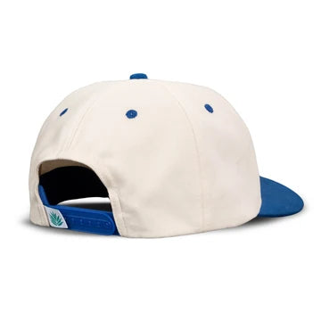 Beige and blue cap with a small logo on a white background