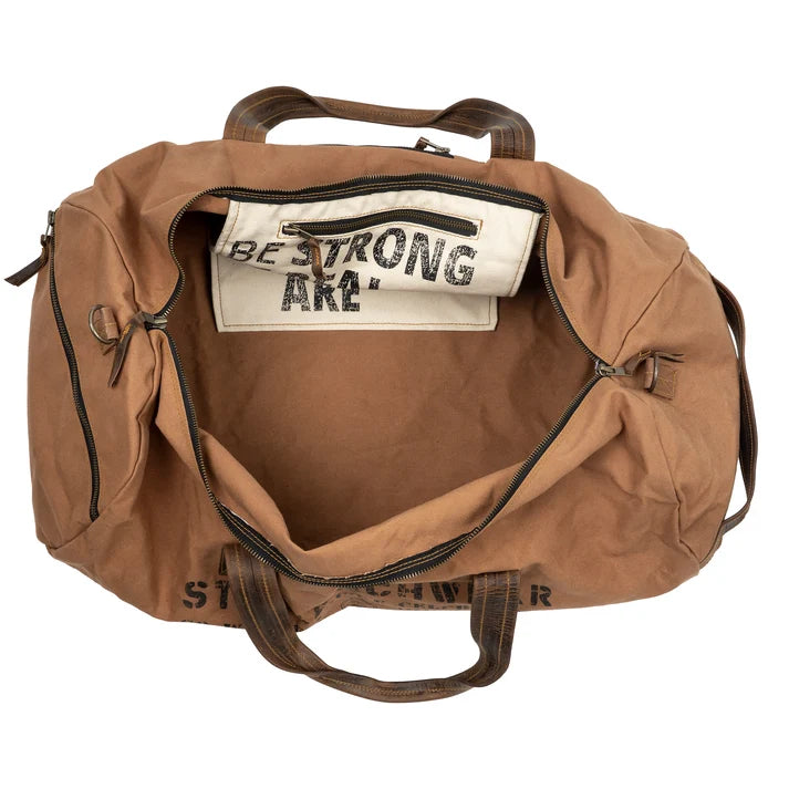 Brown duffel bag with visible text on a white background