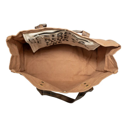 Brown leather bag with visible stitching on a white background