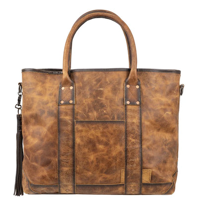 A distressed brown leather tote bag with dual top handles, a front slip pocket, and a black tassel charm on the left side, shown against a plain white background.