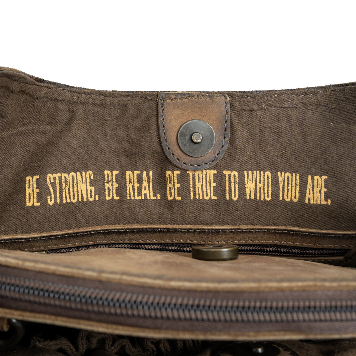 quote "Be Strong, Be Real, Be True to Who You Are." inside STS Ranchwear Cowhide Josie Satchel Jennifer Smith STS Ranch