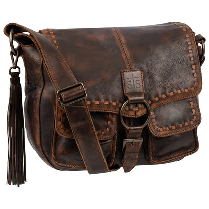 A dark brown distressed leather shoulder bag with a front flap, decorative stitching, a tassel, and a visible 'SIS' logo patch, shown on a plain white background.