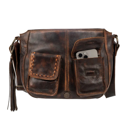 A dark brown distressed leather messenger bag with two front pockets, one of which is open to show a smartphone inside, set against a plain white background.