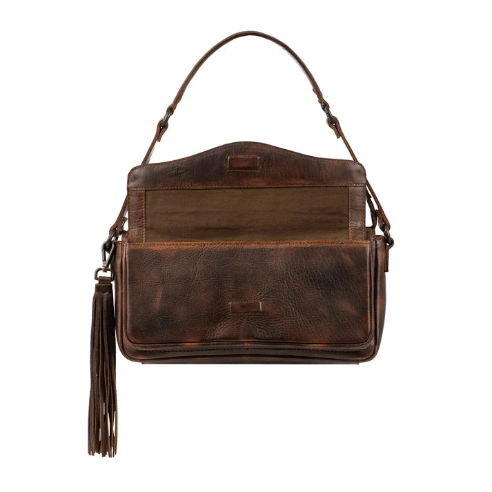 A dark brown leather shoulder bag with a front flap pocket, a top handle, and a long tassel charm, shown against a plain white background.