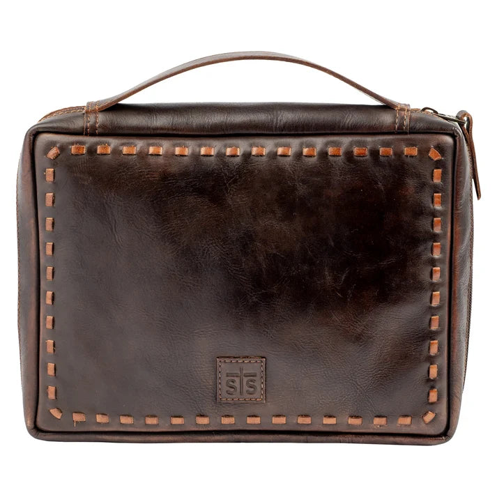 A dark brown leather travel or prayer bag with a top handle, decorative contrast stitching, and a small embossed logo patch on the front, shown against a plain white background.