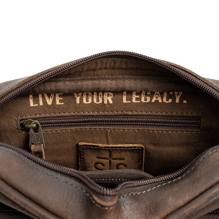 Brown leather bag with 'Live Your Legacy' text and a logo on a white background