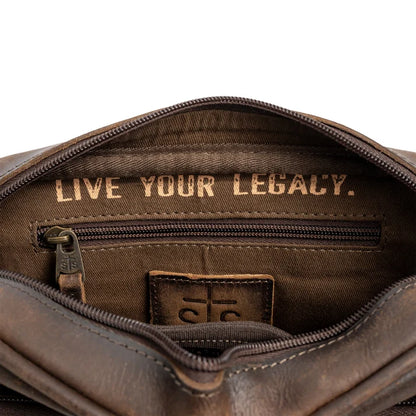 Brown leather bag with 'Live Your Legacy' text and a logo on a white background