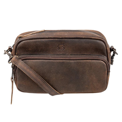 A dark brown distressed leather crossbody bag with a front zippered pocket, embossed 'STS' logo, and a matching leather strap, shown on a plain white background.