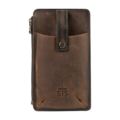 A dark brown distressed leather pouch with a front pocket, snap button strap, and a debossed 'sts' logo on the bottom, shown against a plain white background.