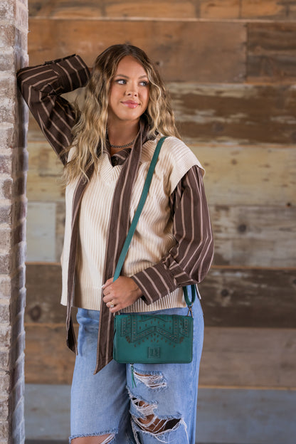 Model wearing the STS Ranchwear Wayfarer Turquoise Evie Organizer crossbody with western cutout and stud details designed by Jennifer Smith STS Ranch