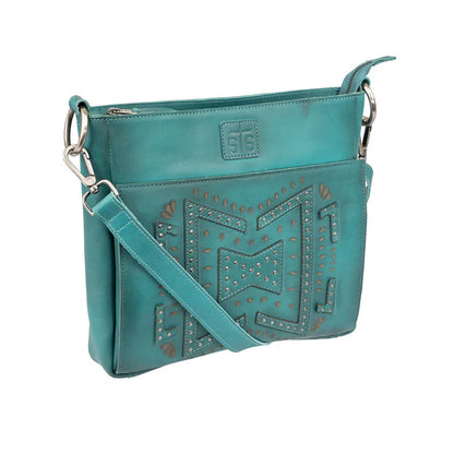 Turquoise leather crossbody purse with studded western design 3/4 view