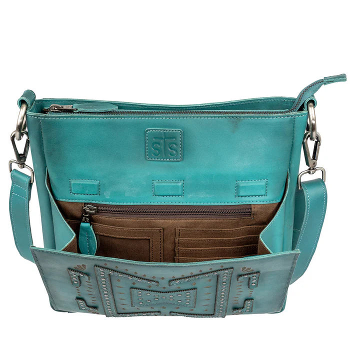 Close-up of Olivia crossbody showing geometric stud detailing with front flap open