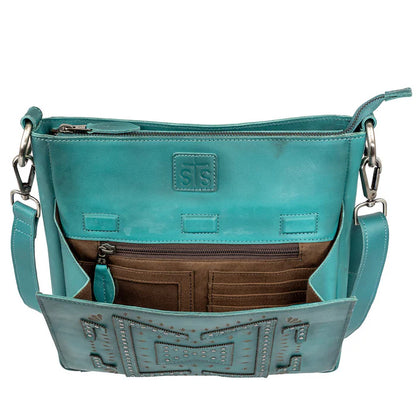 Close-up of Olivia crossbody showing geometric stud detailing with front flap open