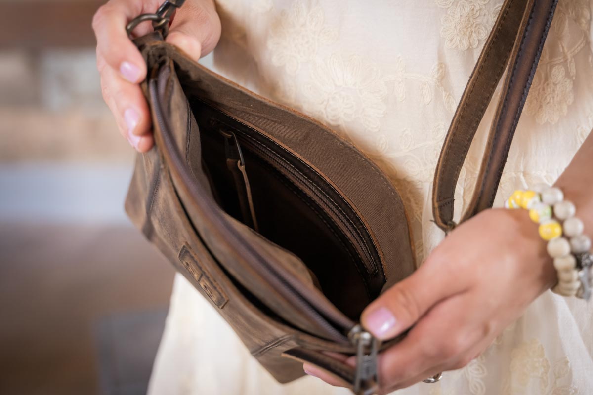 STS Ranchwear Baroness Olivia distressed leather crossbody bag Jennifer Smith STS Ranch lifestyle image interior