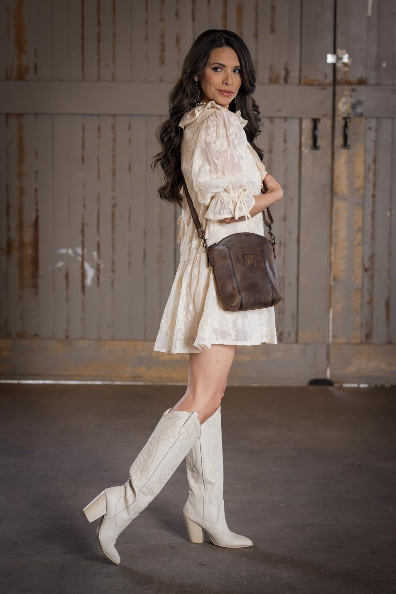 STS Ranchwear Baroness Josie distressed leather crossbody bag Jennifer Smith STS Ranch lifestyle image worn as crossbody