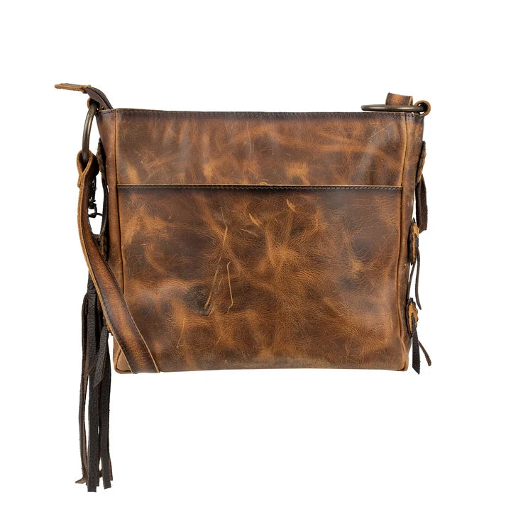 A distressed brown leather crossbody bag with a long strap and hanging tassels, shown against a plain white background.