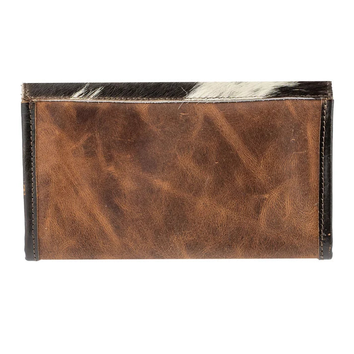 A brown leather wallet with a natural cowhide hair-on-hide top border, shown flat against a white background.