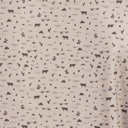 Close-up of desert sand shirt with chocolate western pattern detail