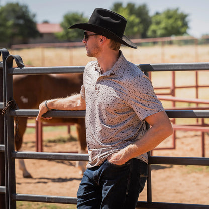 Stran Smith of STS Ranch wearing STS Ranchwear fairway shirt with cowboy hat outdoors
